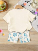 SHEIN 2pcs/Set Toddler Girls' Casual Hibiscus Flower, Marine Life, Shell, Bow Print Loose Round Neck Short Sleeve T-Shirt And Fitted Bike Shorts Set, Suitable For Spring/Summer, Casual, Beach, Weekend, Cute Summer Outfit For Young Girl, Korean Style, Summer Outerwear, Young Girl Summer Clothes, Young Girl Shell Set, Young Girl Beach Set - Image 2