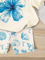 SHEIN 2pcs/Set Toddler Girls' Casual Hibiscus Flower, Marine Life, Shell, Bow Print Loose Round Neck Short Sleeve T-Shirt And Fitted Bike Shorts Set, Suitable For Spring/Summer, Casual, Beach, Weekend, Cute Summer Outfit For Young Girl, Korean Style, Summer Outerwear, Young Girl Summer Clothes, Young Girl Shell Set, Young Girl Beach Set - Image 3